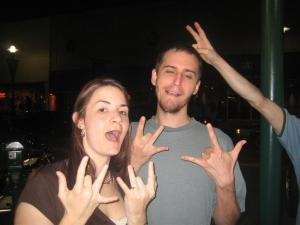 Some made up gang signs?